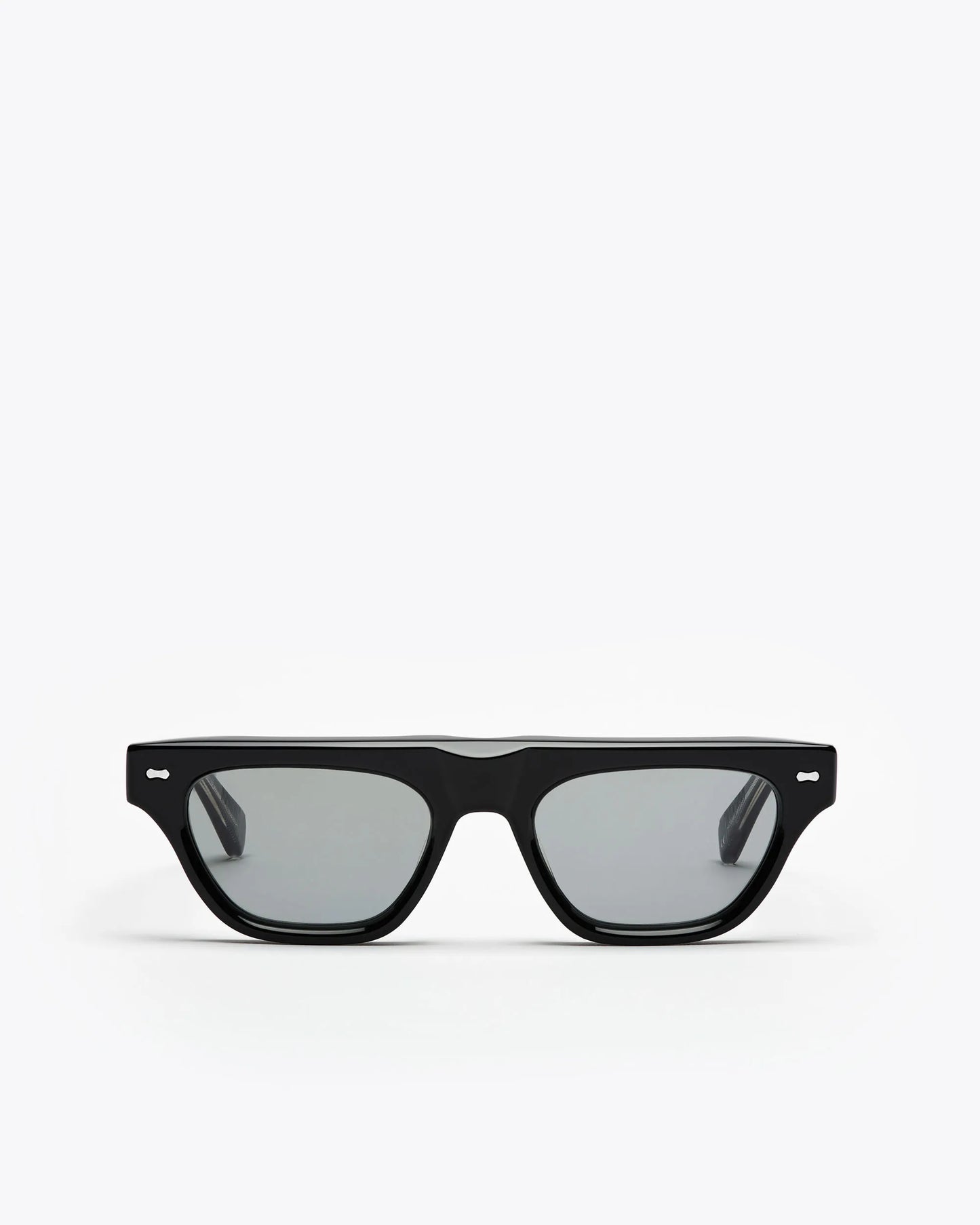 Black framed cat-eye sunglasses with grey lenses on a white background