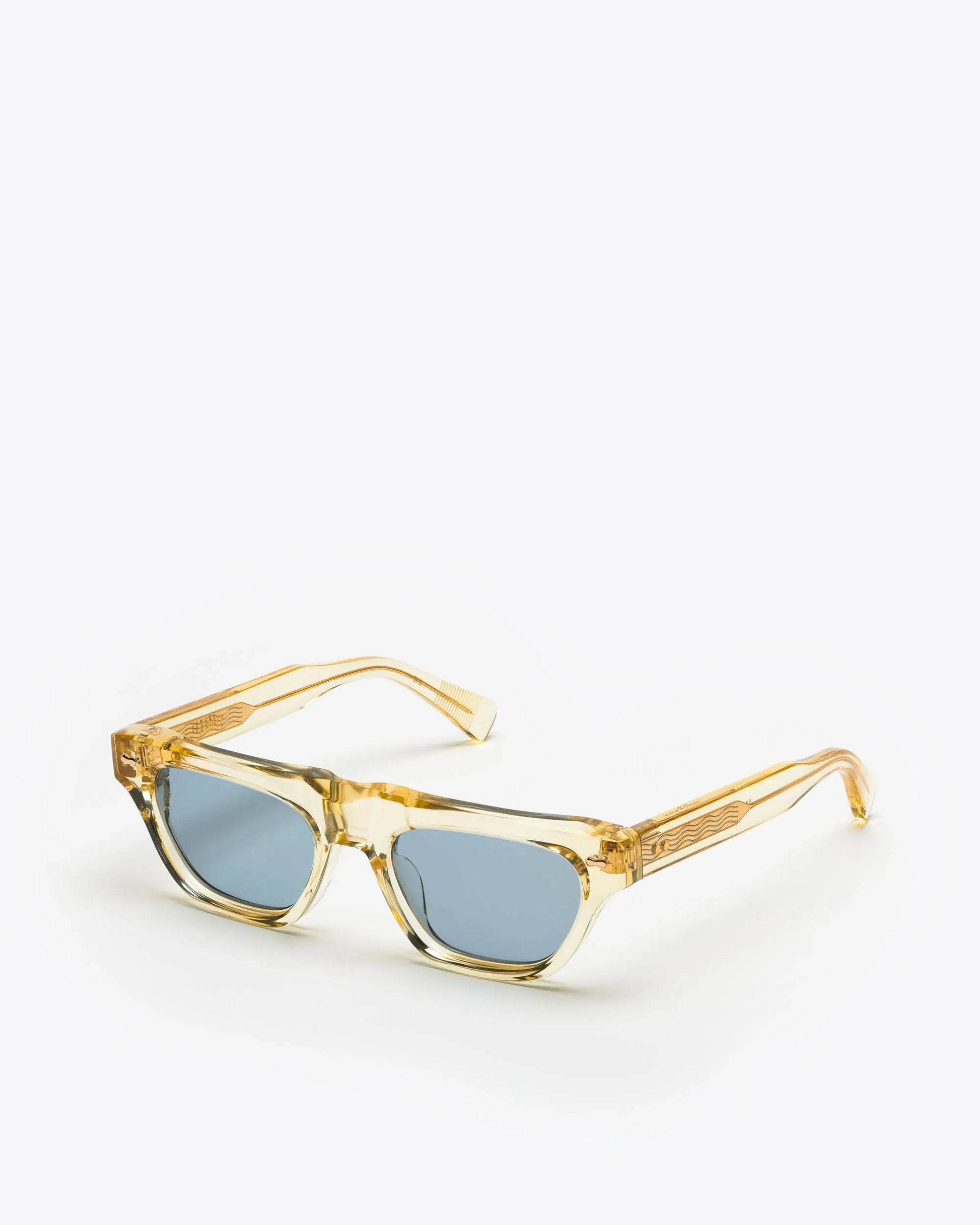 Rectangular-shaped sunglasses with a champagne yellow frame and blue lenses on a white background