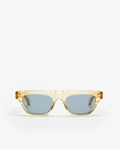 Rectangular-shaped sunglasses with a champagne yellow frame and blue lenses on a white background