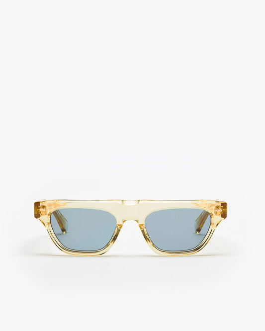 Rectangular-shaped sunglasses with a champagne yellow frame and blue lenses on a white background