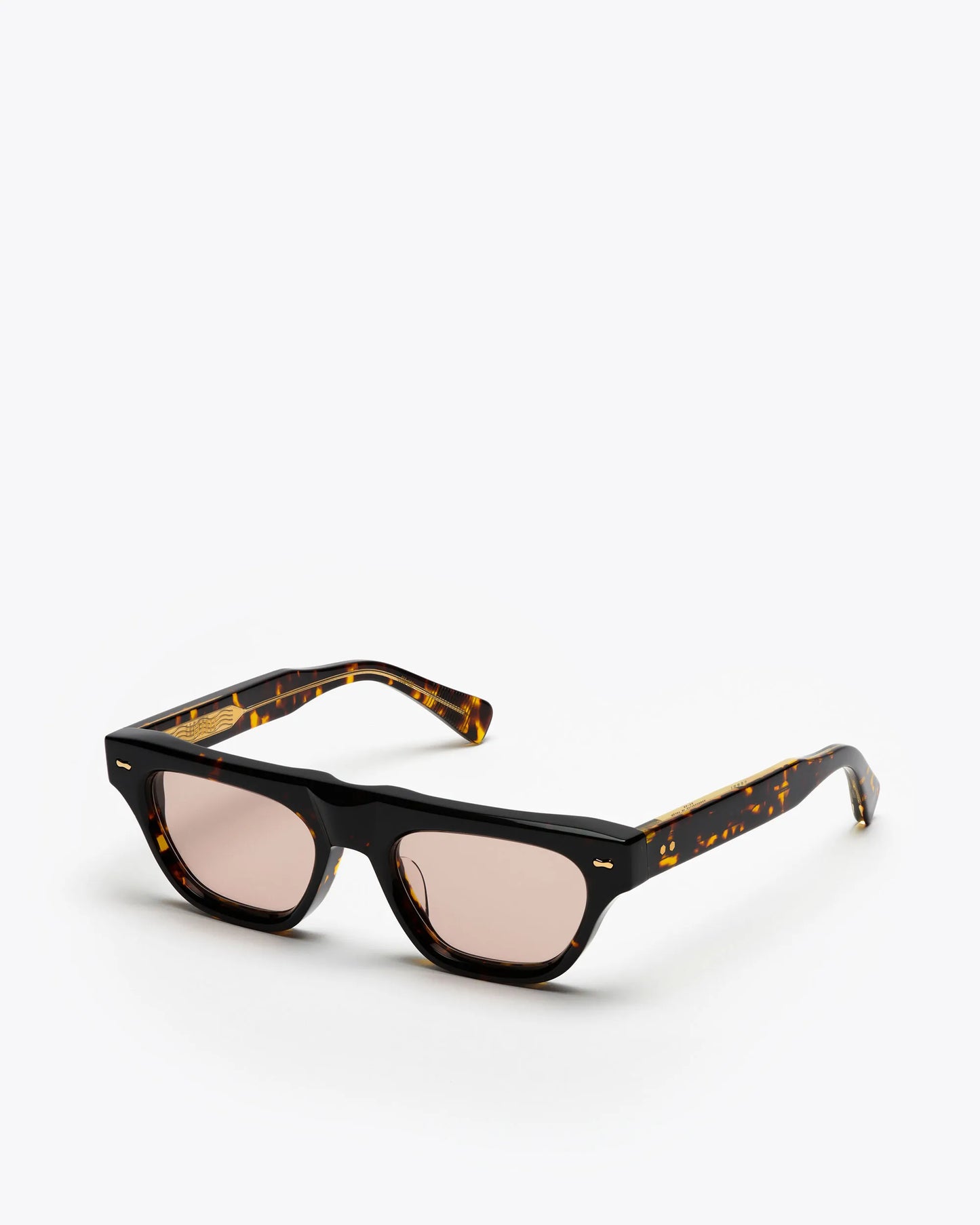 Cat-eye sunglasses with tortoiseshell frame and brown lenses on a white background