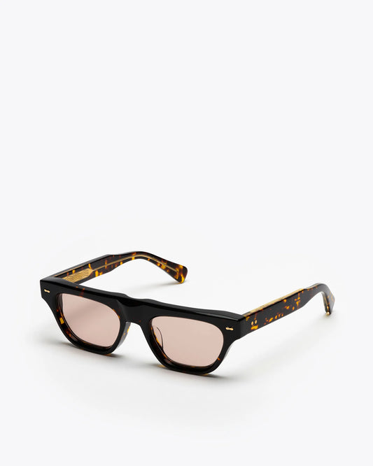Cat-eye sunglasses with tortoiseshell frame and brown lenses on a white background