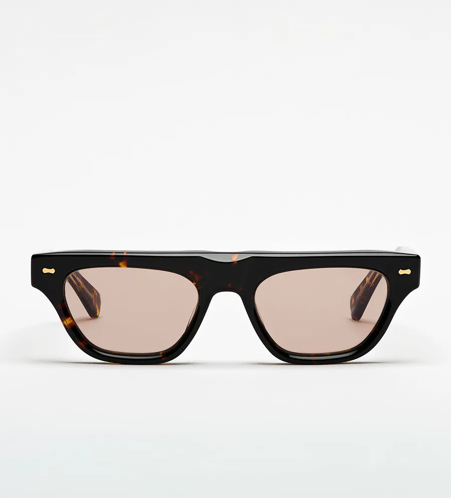 Sunglasses with tortoiseshell frame and brown lenses on a white background