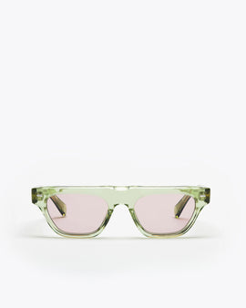 Rectangular-shaped sunglasses with seafoam green frame and lilac lenses on a white background