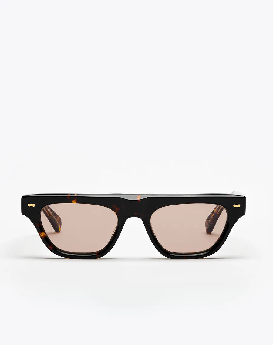 Sunglasses with a tortoiseshell frame and brown lenses on a white background