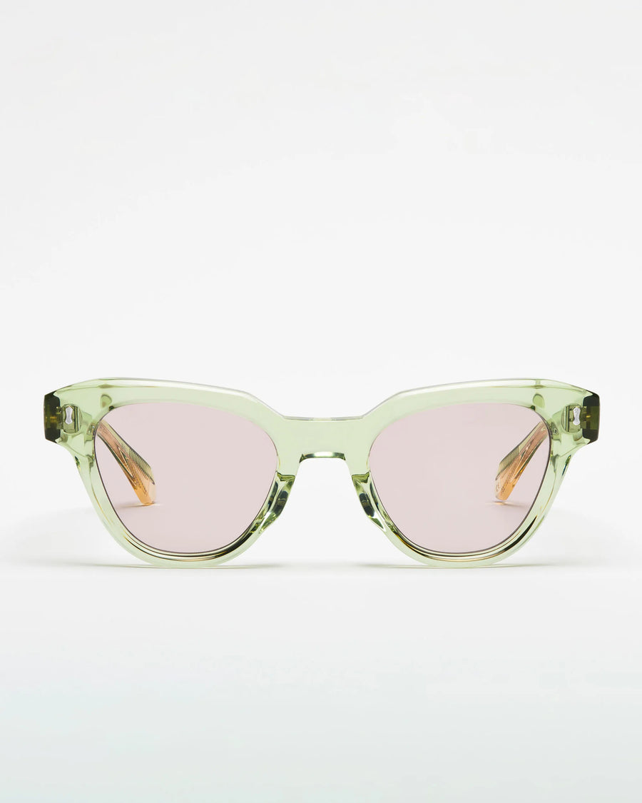 Seafoam green sunglasses with lilac lenses on a white background