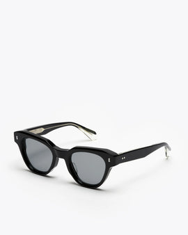 Black cat-eye sunglasses with gray lenses on a white background