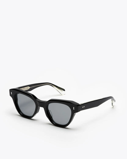 Black cat-eye sunglasses with gray lenses on a white background