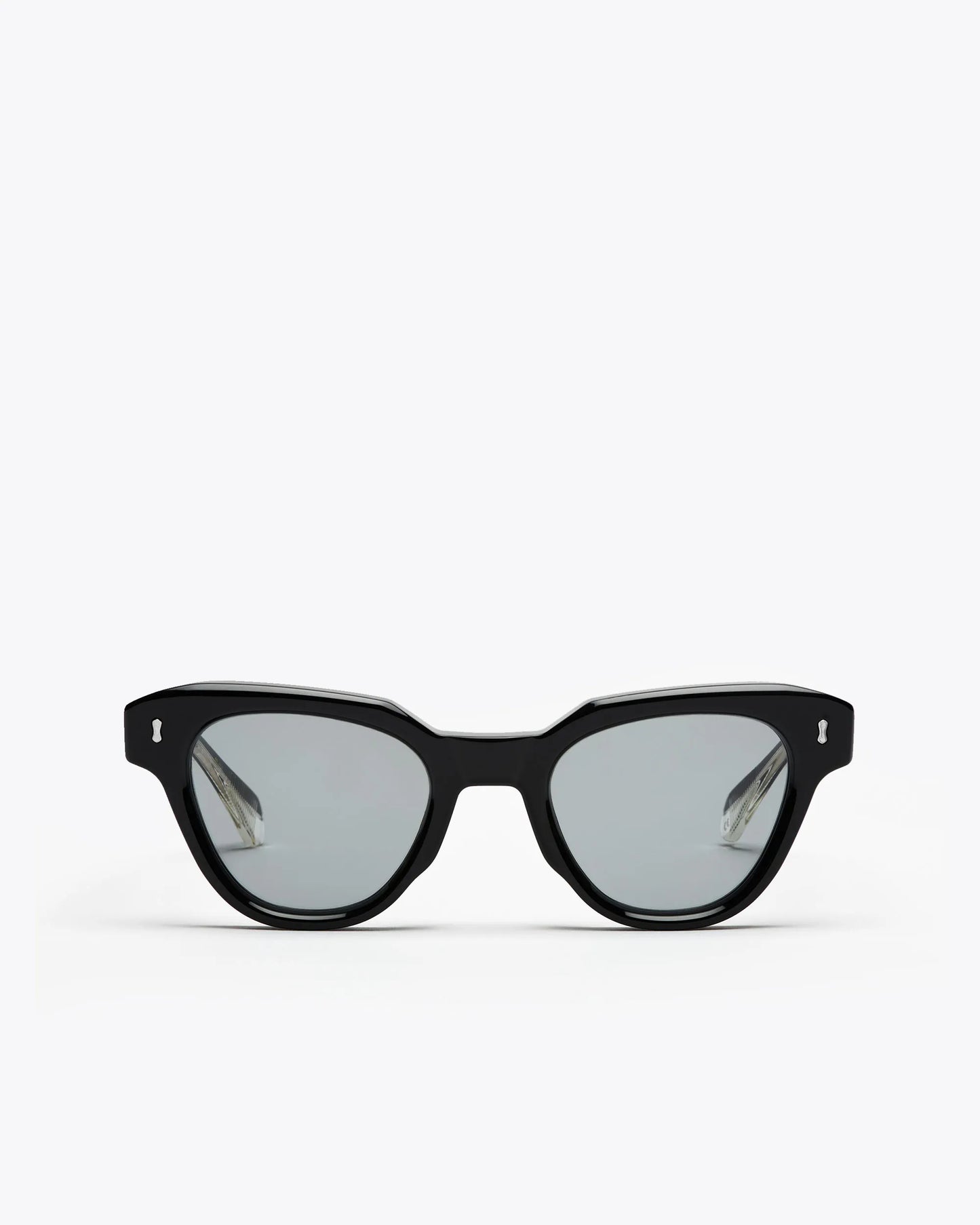 Black cat-eyesunglasses with grey lenses on a white background