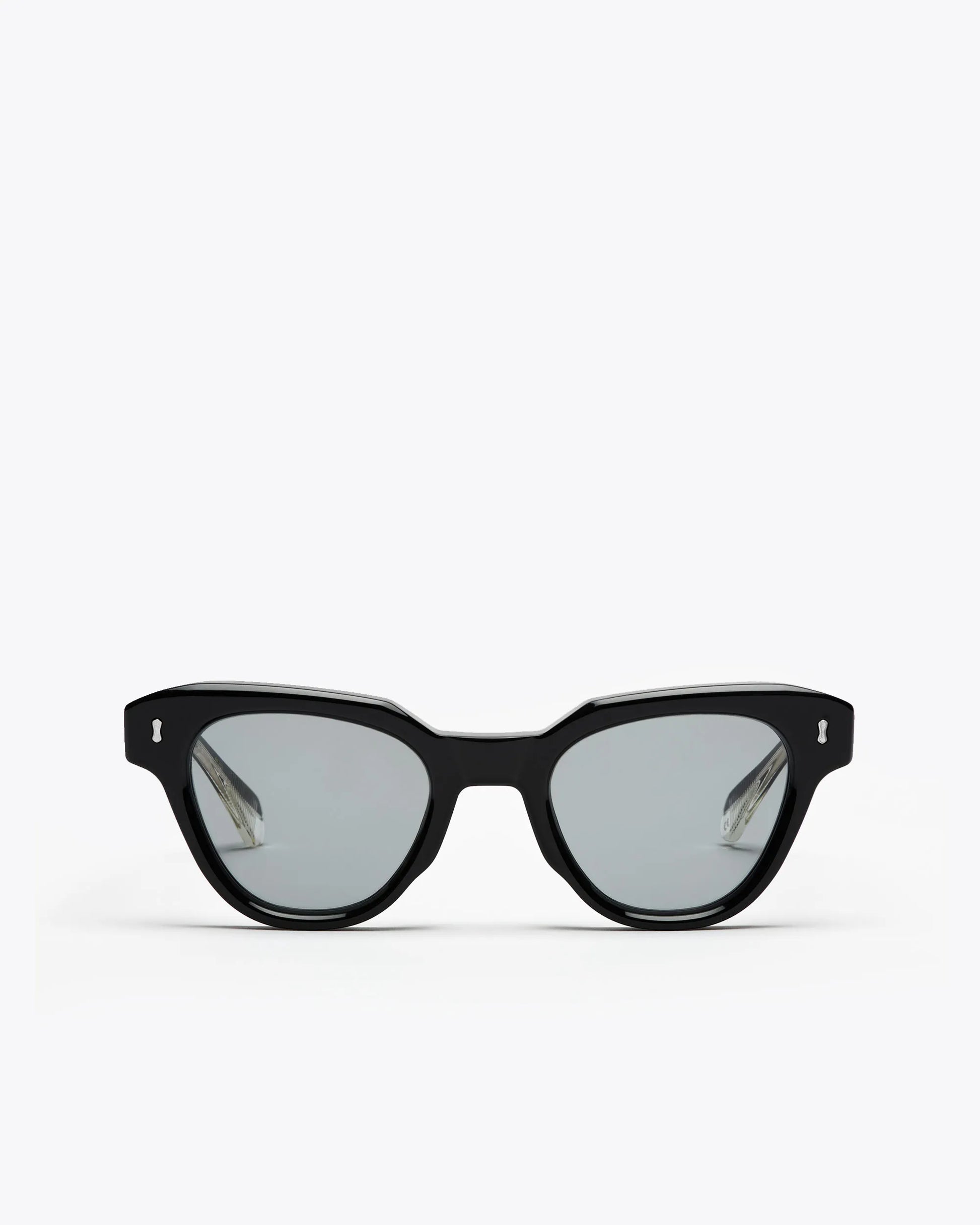 Black cat-eyesunglasses with grey lenses on a white background