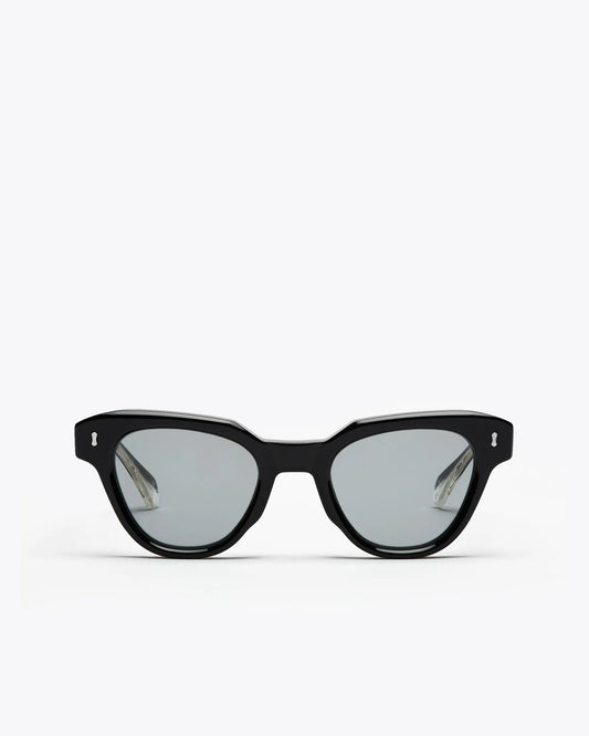 Black cat-eyesunglasses with grey lenses on a white background