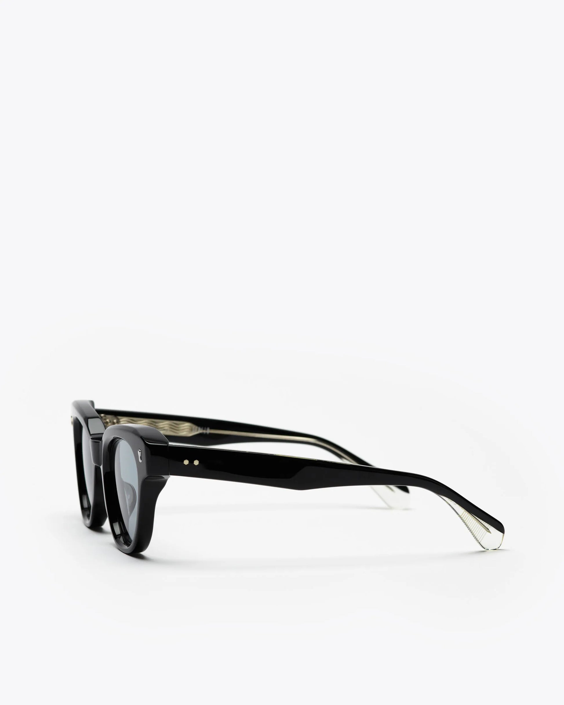 Black cat-eyesunglasses with grey lenses on a white background