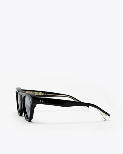 Black cat-eyesunglasses with grey lenses on a white background
