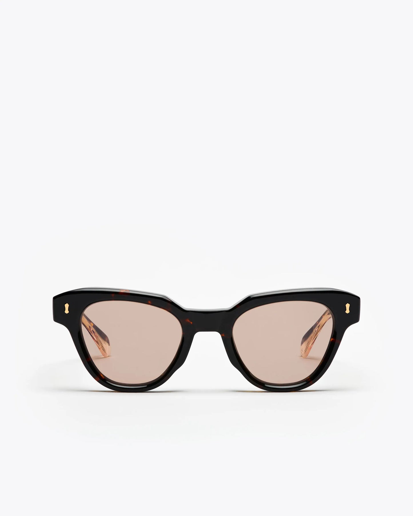 Tortoiseshell cat-eye sunglasses with brown lenses on a white background