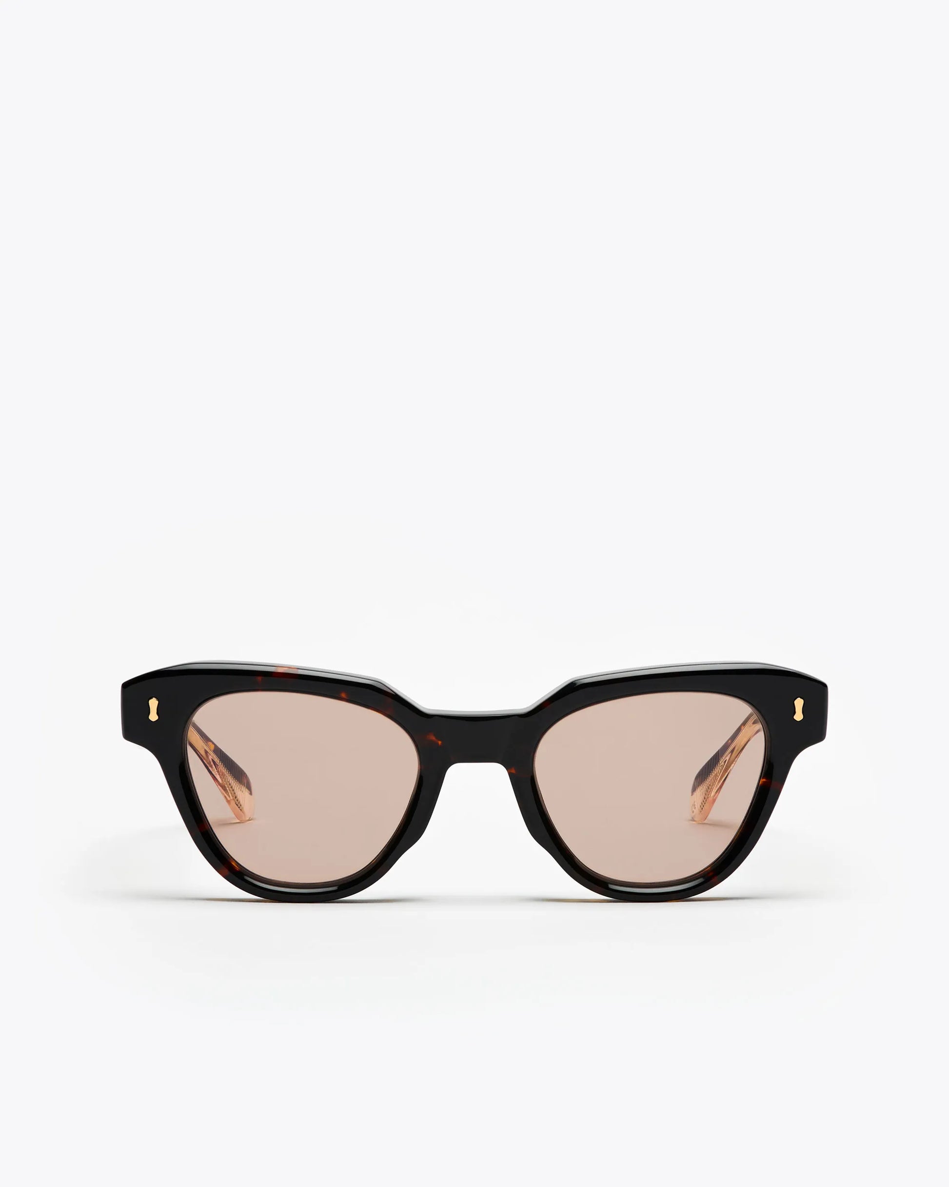 Tortoiseshell cat-eye sunglasses with brown lenses on a white background