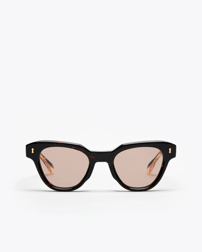 Tortoiseshell cat-eye sunglasses with brown lenses on a white background