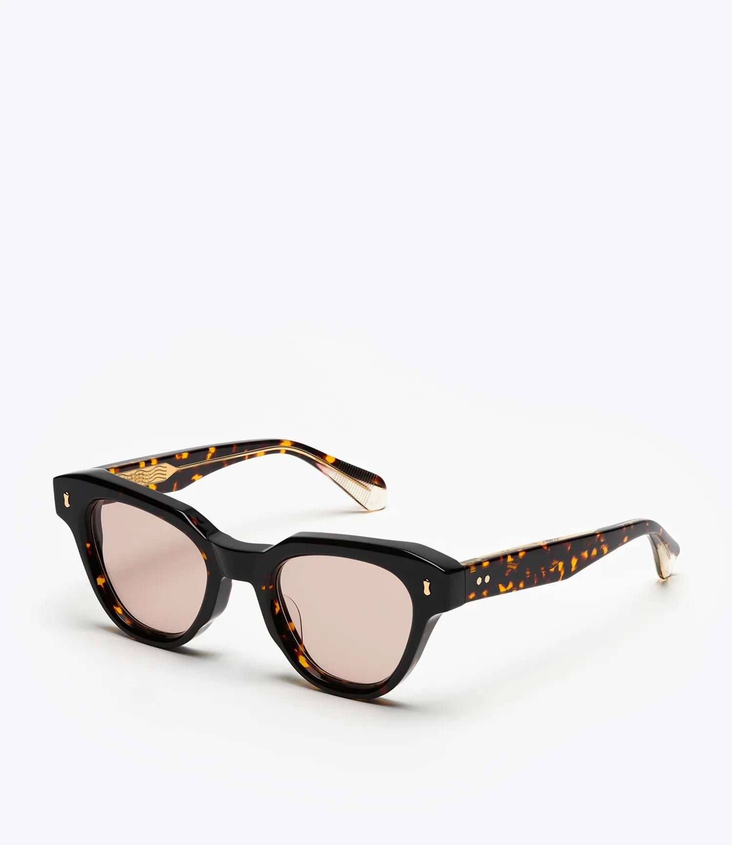Sunglasses with tortoiseshell frame and brown lenses on a white background