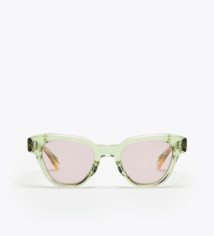 Green sunglasses with lilac lenses on a white background