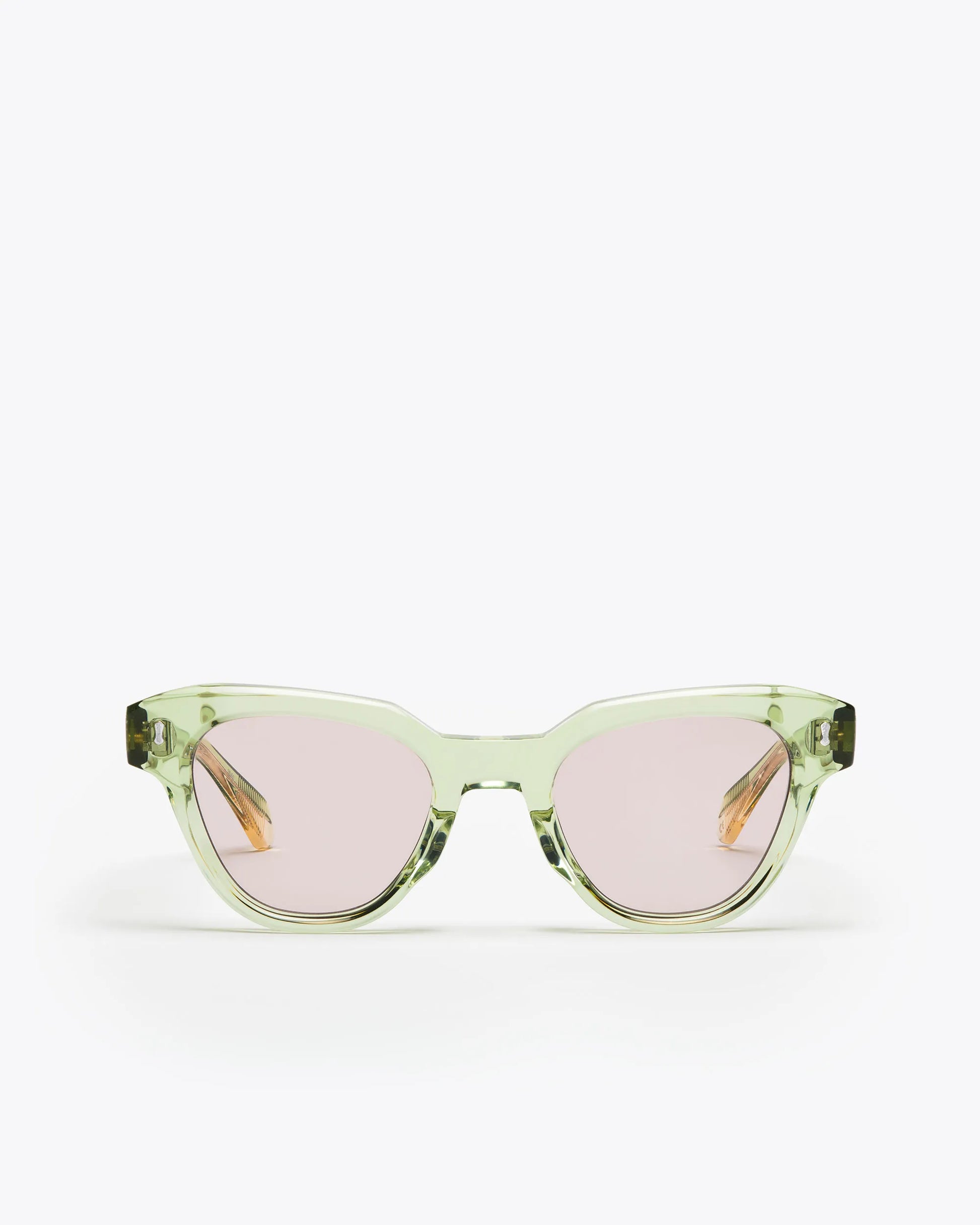 Seafoam green sunglasses with lilac lenses on a white background
