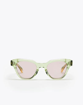 Seafoam green sunglasses with lilac lenses on a white background