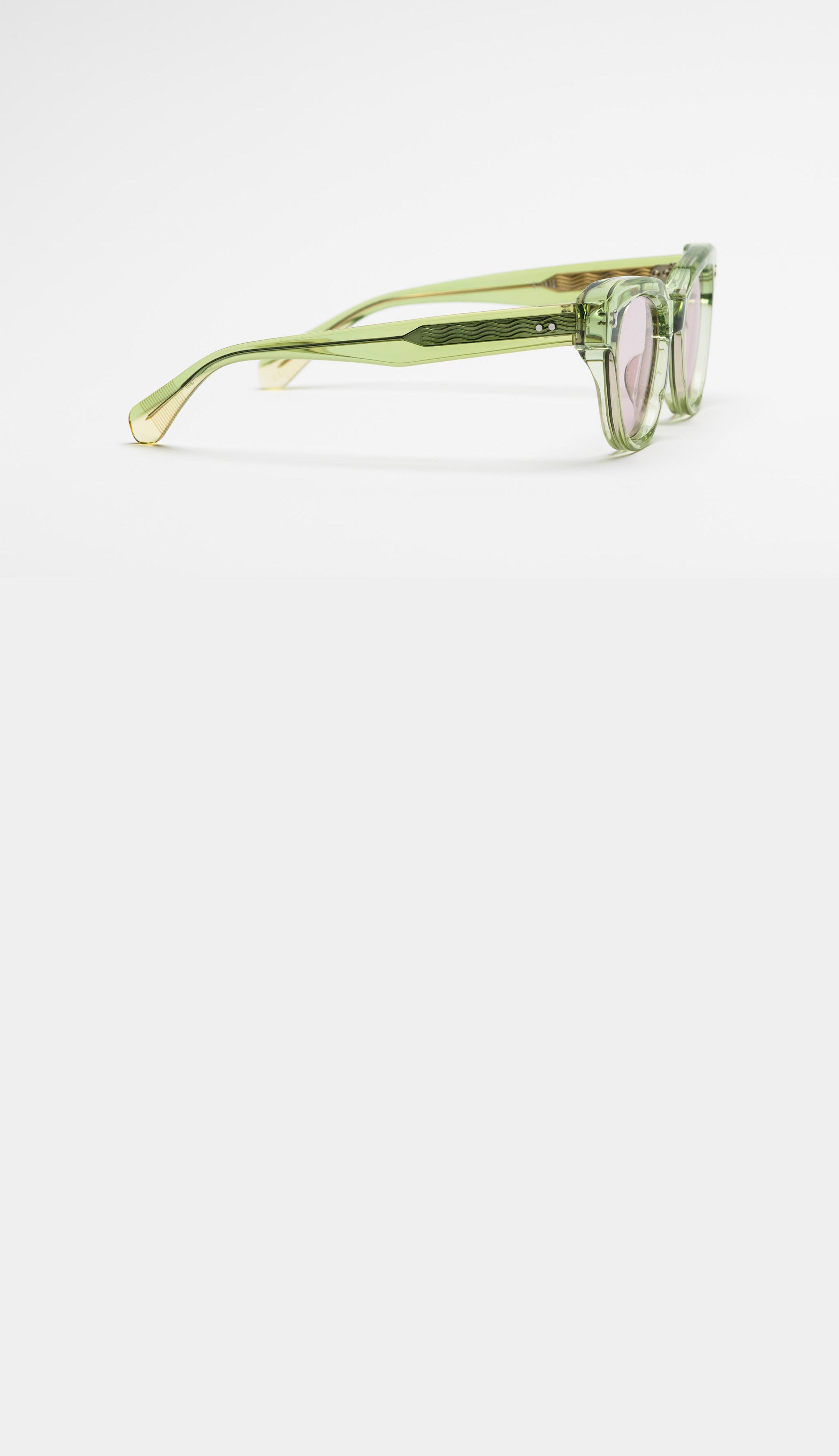 Green sunglasses on a white background