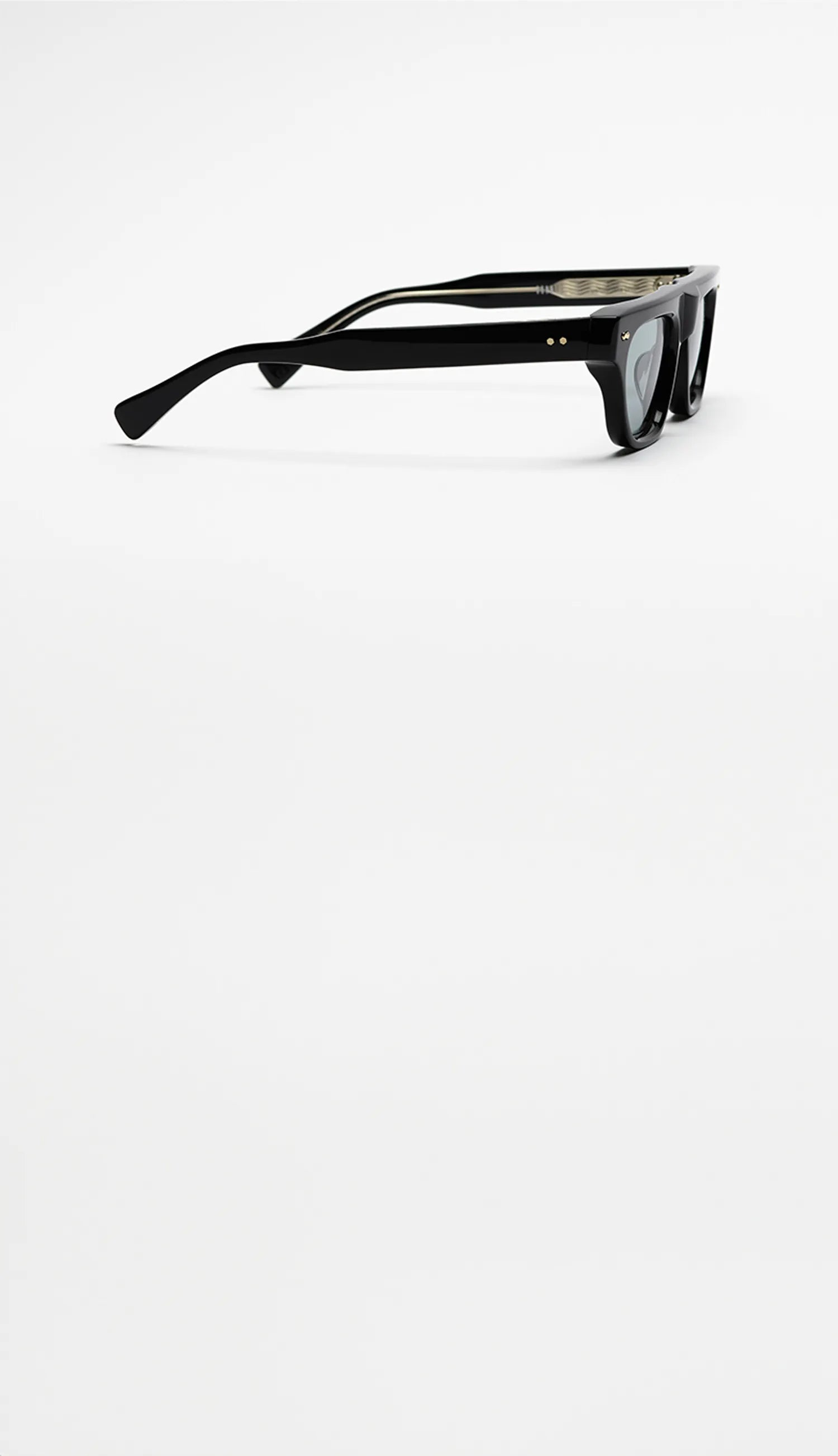 Black sunglasses with blue lenses on a white background