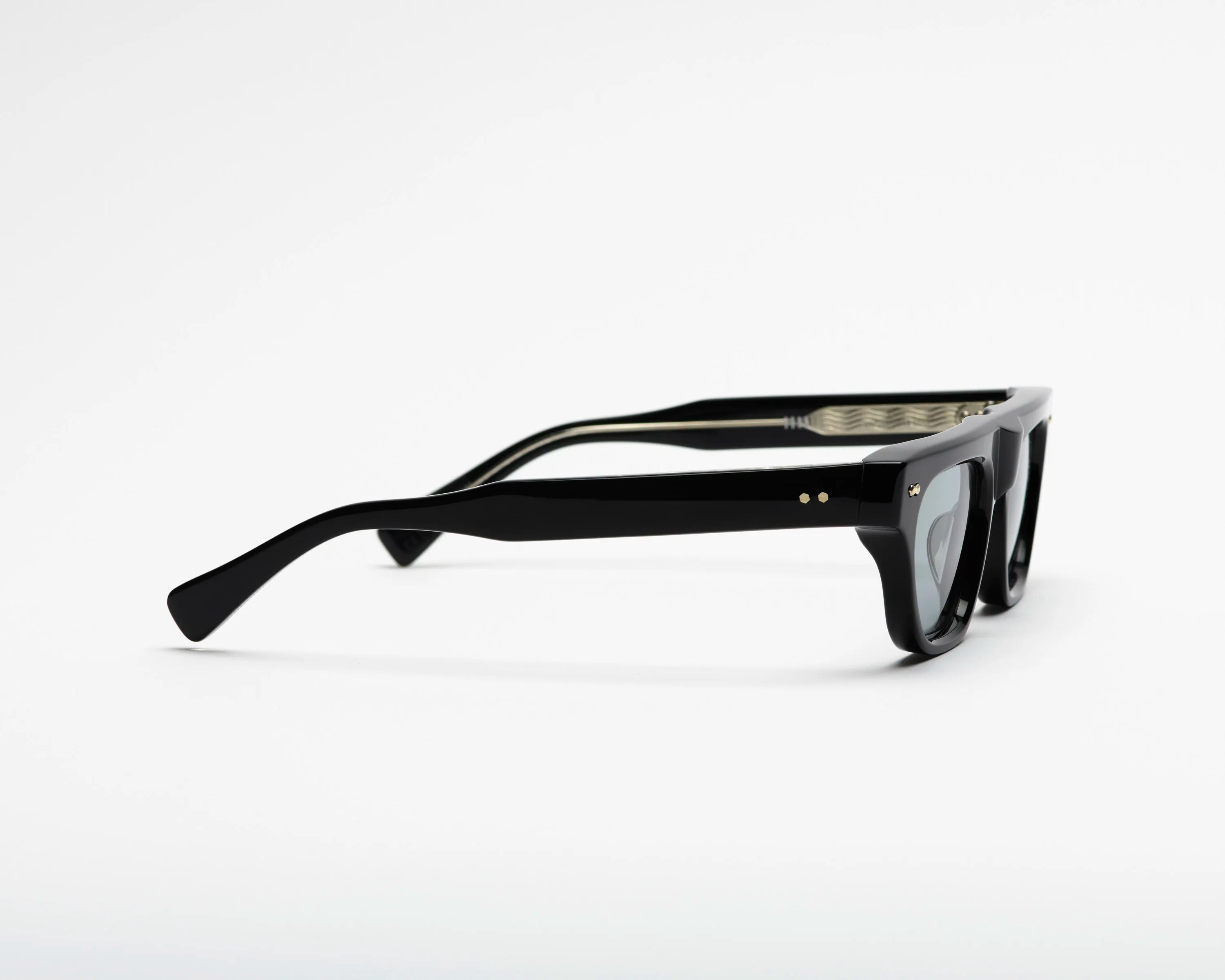Black sunglasses with blue lenses on a white background