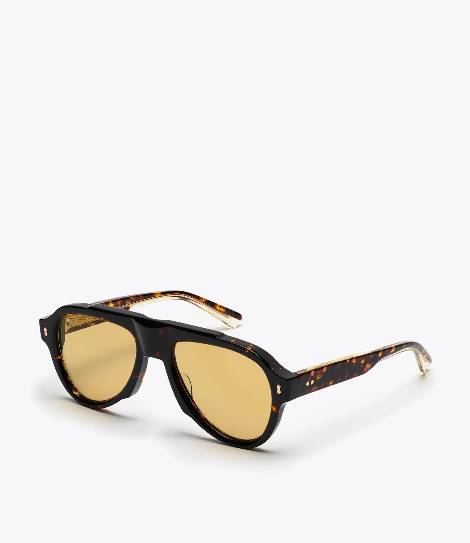 Aviator style sunglasses with tortoiseshell frame and amber lenses on a white background