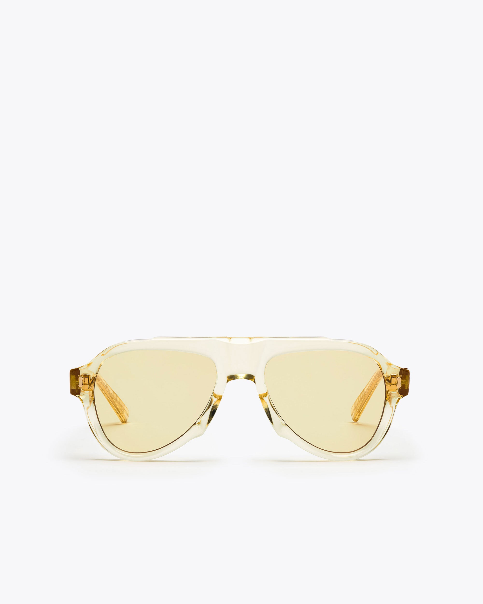 Champagne yellow-framed sunglasses with yellow-tinted lenses on a white background