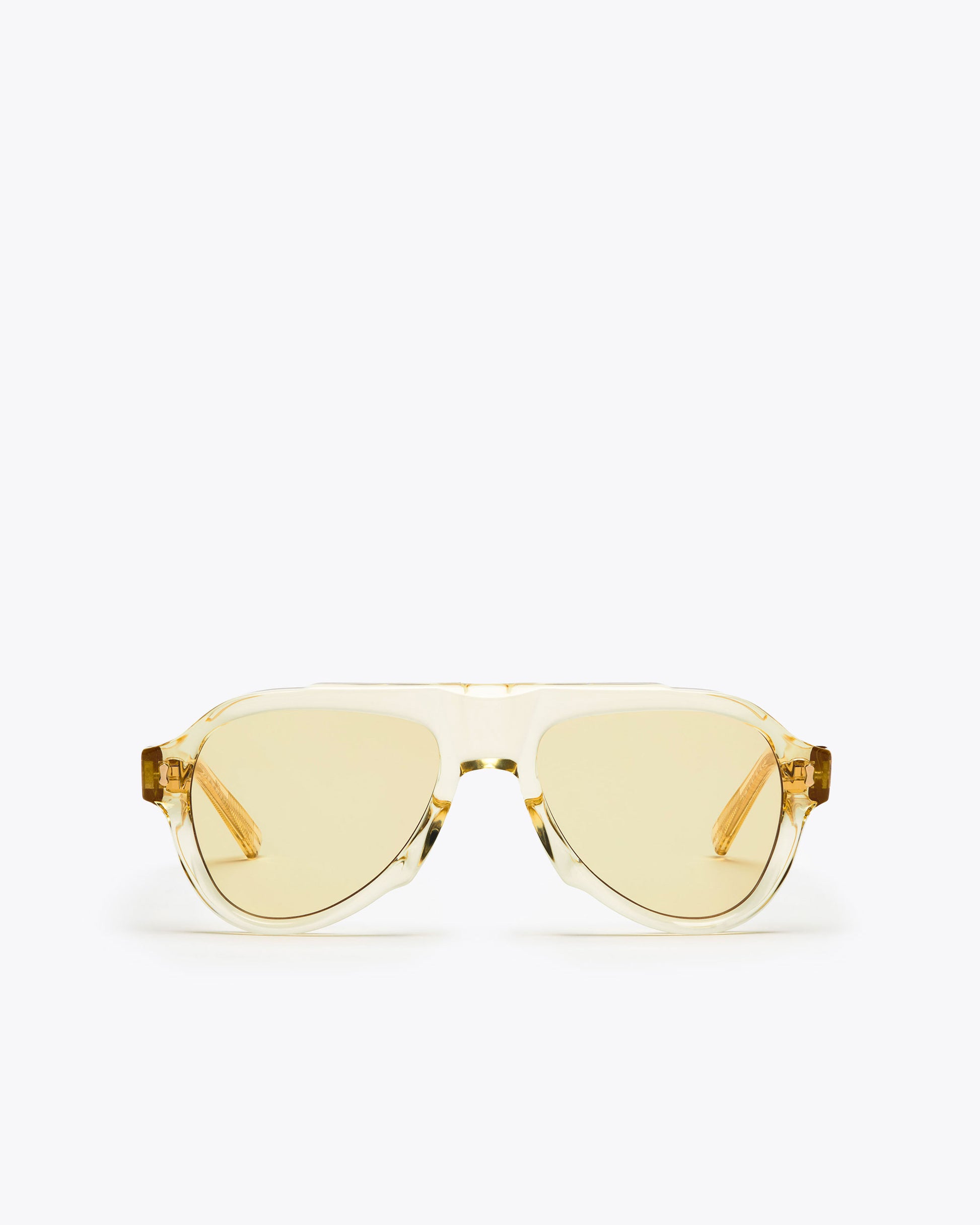 Champagne yellow-framed sunglasses with yellow-tinted lenses on a white background