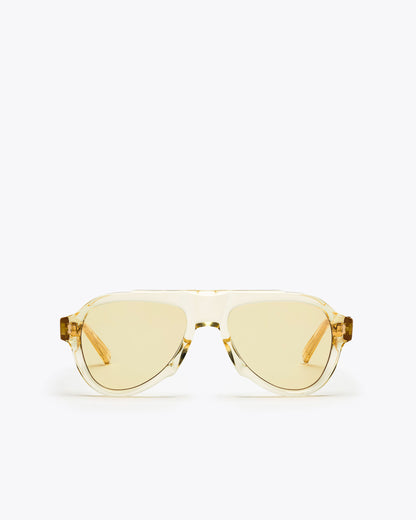 Champagne yellow-framed sunglasses with yellow-tinted lenses on a white background