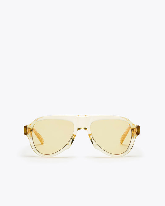 Champagne yellow-framed sunglasses with yellow-tinted lenses on a white background